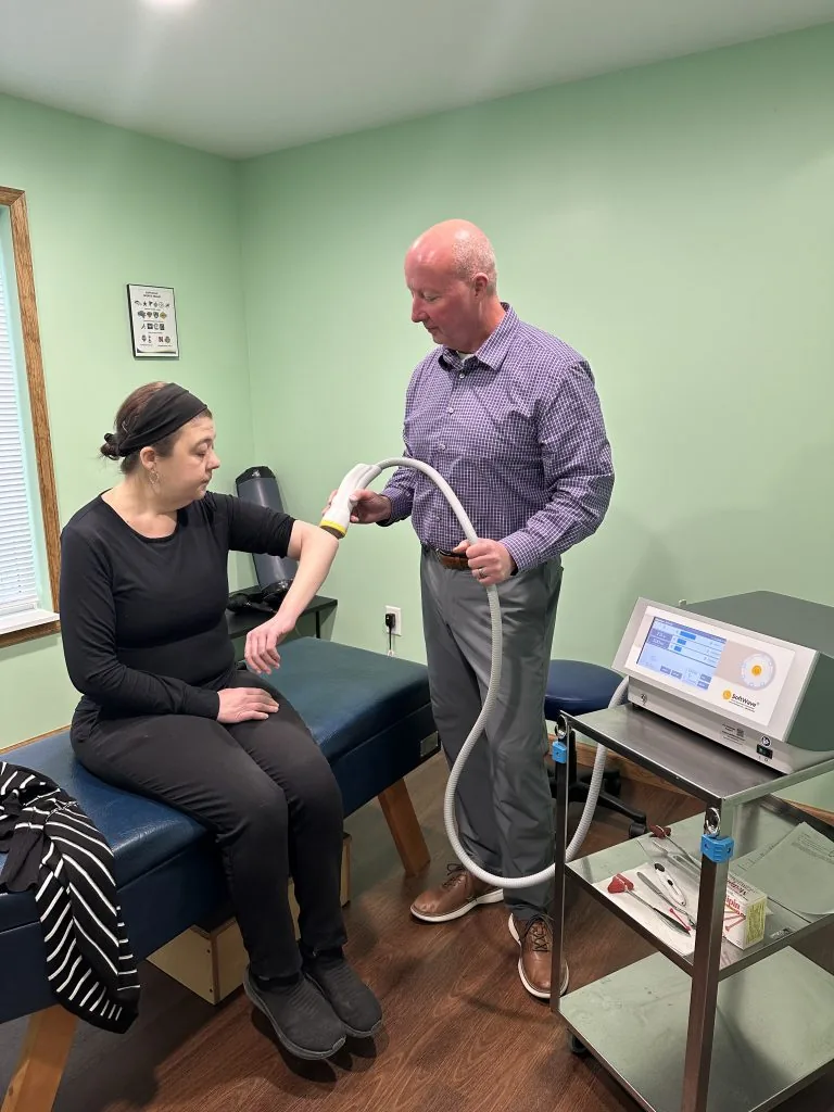 Dr. Matt Chenault, D.C. treating a patient at Greenville Rehab and Pain Clinic